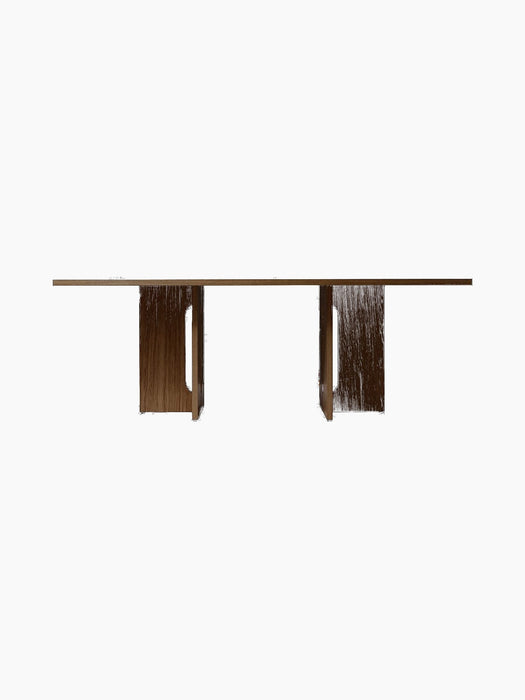 Front view of the Androgyne Rectangular Dining Table in dark stained oak, showing its wide, sculptural legs and long top.