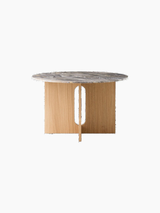 Front view of the round Androgyne Dining Table with a Grey Galaxy Marble top and a natural oak base with a vertical slit.