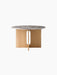 Front view of the round Androgyne Dining Table with a Grey Galaxy Marble top and a natural oak base with a vertical slit.