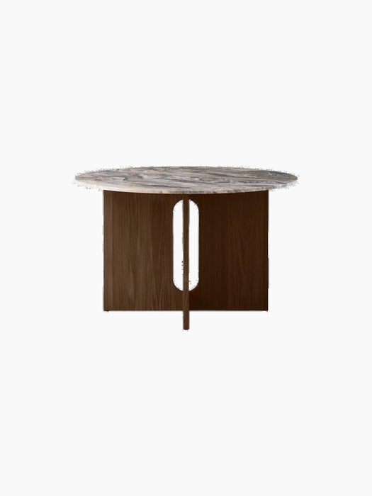 Front view of the Androgyne Dining Table with a round Grey Galaxy Marble top and a dark stained oak base with panel cutouts.