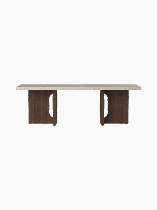 Front view of the Androgyne Lounge Table, featuring a dark stained oak base with cut-outs and a Kunis Breccia stone top.
