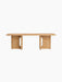 The Androgyne Lounge Table in natural oak. A long, low rectangular table with two solid legs featuring distinctive cutouts.