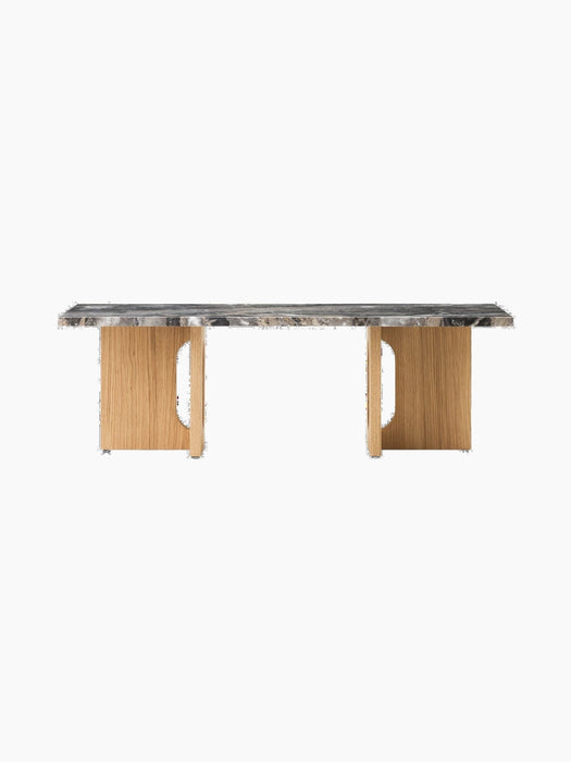 Front view of the Androgyne Lounge Table. It has a Grey Galaxy marble top and a natural oak base with distinctive cut-outs.
