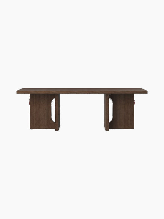 Front view of the dark stained oak Androgyne Lounge Table, showcasing its rectangular top and legs with signature cut-outs.