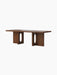 Angled view of the Androgyne Lounge Table in dark walnut, featuring a rectangular top and two block legs with oval cutouts.