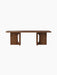 A front view of the Androgyne Lounge Table in a walnut finish. The long, low coffee table features two wide, block-like legs.