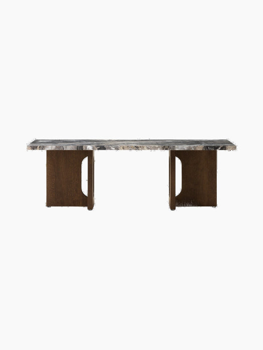 A front view of the Androgyne Lounge Table, featuring a Grey Galaxy marble top on a dark stained oak base with cutouts.