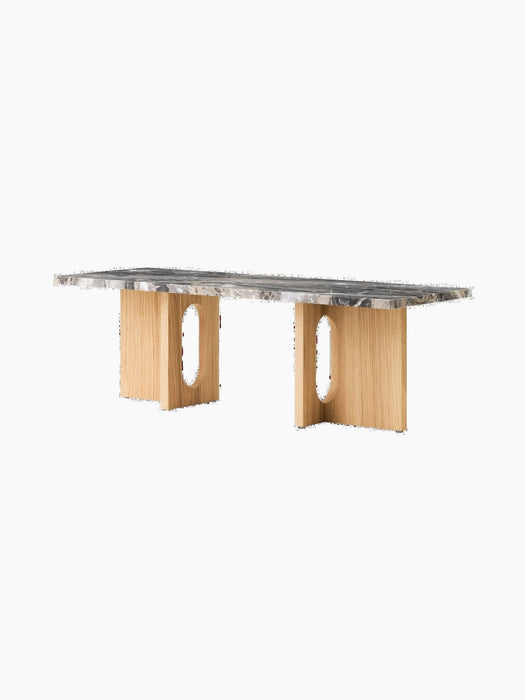 Androgyne Lounge Table with a rectangular Grey Galaxy marble top and a natural oak veneer base with two large oval cutouts.