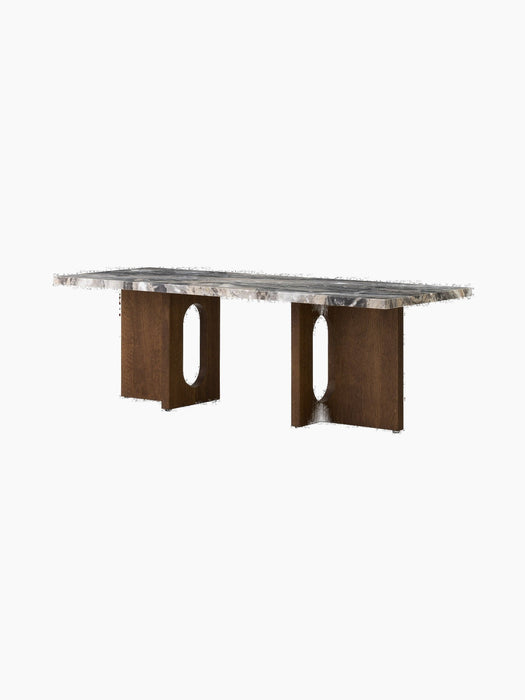 A rectangular Androgyne Lounge Table with a grey veined marble top and two dark oak legs, each featuring a large oval cutout.