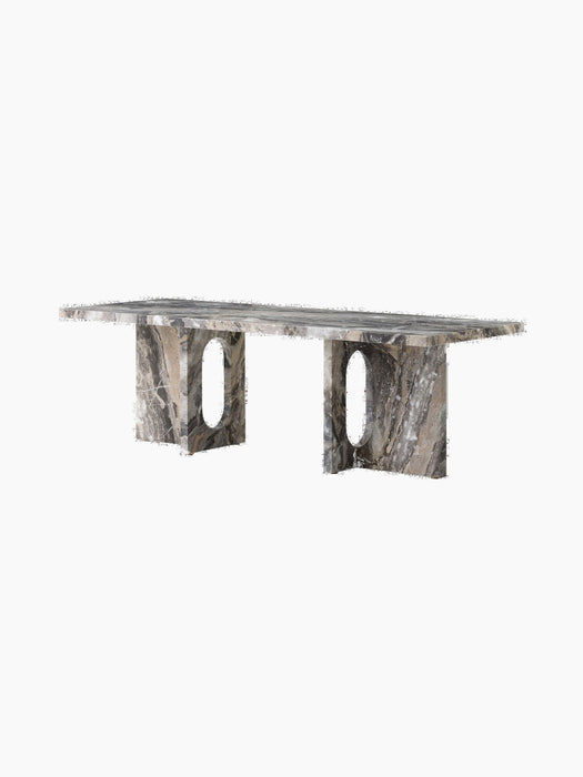 Angle view of the Androgyne Lounge Table, crafted from Grey Galaxy marble with a rectangular top and two panel legs.
