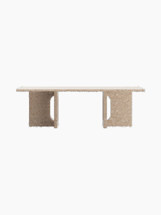 A straight-on shot of the Androgyne Lounge Table in Kunis Breccia stone, with its rectangular top and two wide, cutout legs.