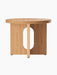 Front view of the Androgyne Side Table, Ø50 in natural oak, showing its round top and distinctive base with an oval cutout.