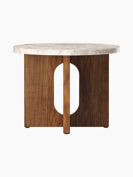 Androgyne Side Table, Ø50, with a round, light-veined Kunis Breccia stone top and a walnut base with a central oval cutout.