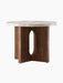 Angled studio shot of the Androgyne Side Table, Ø50, featuring a round Kunis Breccia stone top on a dark walnut veneer base.