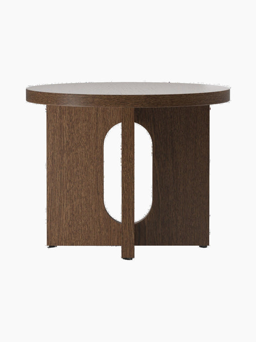 Back view of the Androgyne Side Table, Ø50, in dark stained oak, showing its round top and flat legs with an oval cutout.