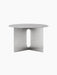 Angled front view of the Androgyne Side Table Ø63 in brushed steel, showing its round top and base with an oval cutout.