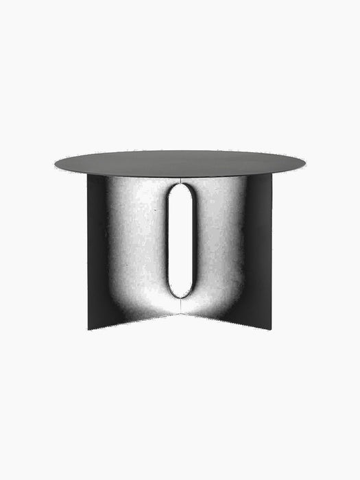 An angle view of the black Androgyne Side Table Ø63 with its distinctive base featuring an oval-shaped opening.