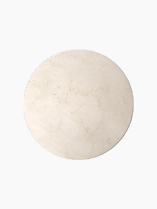 A circular Androgyne Side Tabletop in Crystal Rose Marble, seen from a top-down perspective against a black background.