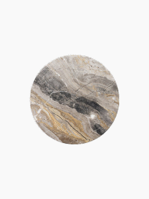 A circular slab of polished marble with intricate veins of grey, charcoal, white, and gold, viewed from directly above.