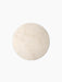 A top-down view of the round, ivory marble tabletop for the Androgyne Side Table, shown against a plain black background.
