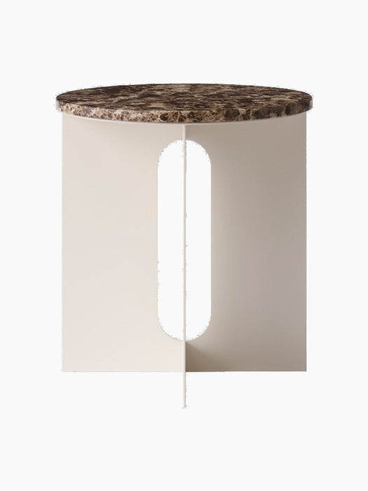 Front view of the Androgyne Side Table, featuring a round Emperador marble top and a sculptural ivory base with a cutout.