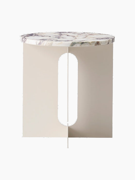 Front view of the Androgyne Side Table, featuring a round Calacatta Viola marble top on a solid ivory base with a cut-out.