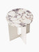 A top-down view of the Androgyne Side Table, featuring a round Calacatta Viola marble top with purple veins on an ivory base.