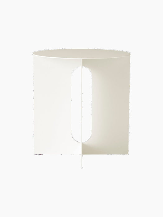 A front-on studio photograph of the ivory steel base for the Androgyne Side Table, showing its vertical pill-shaped cutout.