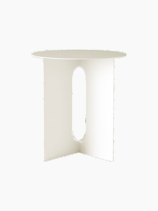 A front-facing image of the Androgyne Side Table. The piece is ivory-coloured with a round top and a base with oval cutouts.