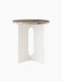 Androgyne Side Table with an ivory steel base featuring oblong cutouts, topped with a round Grey Galaxy marble slab.