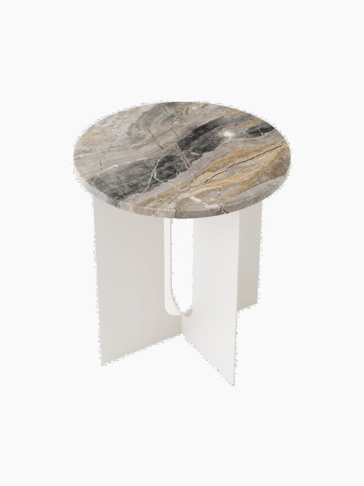 An angled, top-down view of the Androgyne Side Table, featuring a round Grey Galaxy marble top and an ivory steel base.