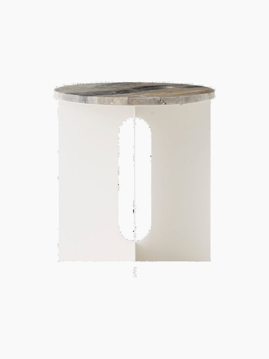 The Androgyne Side Table from the front, featuring an ivory base with a vertical cutout and round Grey Galaxy marble top.