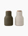 Bottle Grinders with walnut lids, one in matte hunting green and the other in matte beige, against a black background.