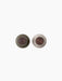 Top-down view of two Bottle Grinders with walnut lids on a black background. One is hunting green and the other is beige.