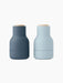 Two small Bottle Grinders with light wood Beach Lids, shown from the front. One is dark blue, the other is light blue.