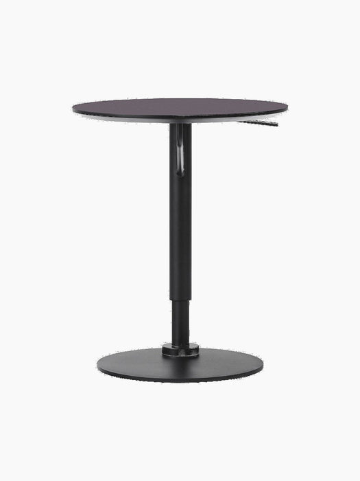 A front view of the Branch Side Table in Charcoal Linoleum, showing its round top and height-adjustable black steel base.