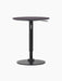 A front view of the Branch Side Table in Charcoal Linoleum, showing its round top and height-adjustable black steel base.