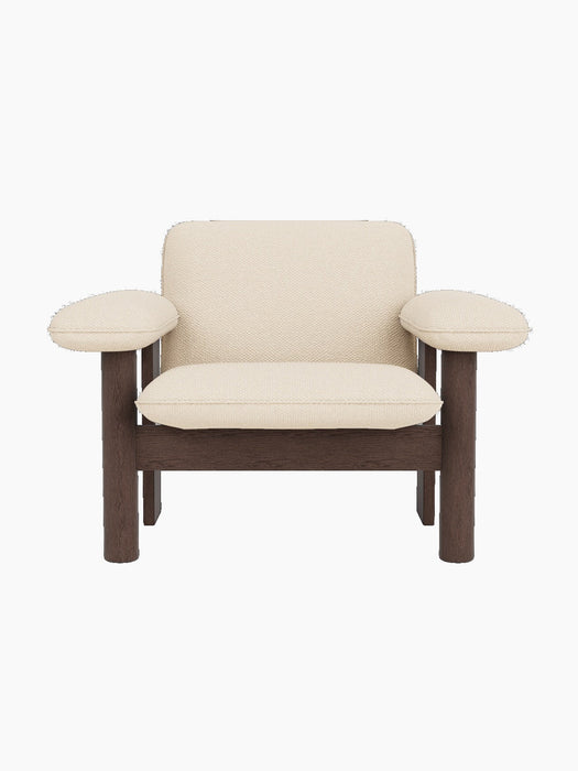 Front view of the Brasilia Lounge Chair, Low Back, with a dark stained oak frame and light Logan Jasmine textile upholstery.