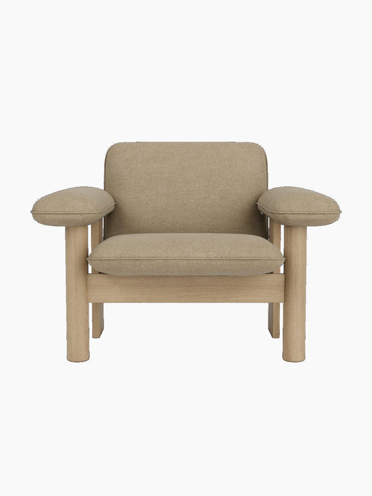 Front view of the Brasilia Lounge Chair, Low Back, with a natural oak frame and upholstered in light beige Audo Bouclé 02.