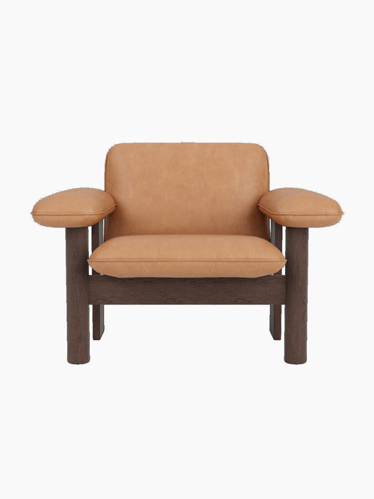 Front view of the Brasilia Lounge Chair, Low Back, featuring a dark stained oak frame and camel leather upholstery.