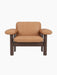 Front view of the Brasilia Lounge Chair, Low Back, featuring a dark stained oak frame and camel leather upholstery.