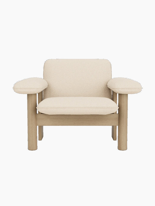 Front view of the Brasilia Lounge Chair, Low Back, with a natural oak frame and upholstered in light Logan Jasmine textile.