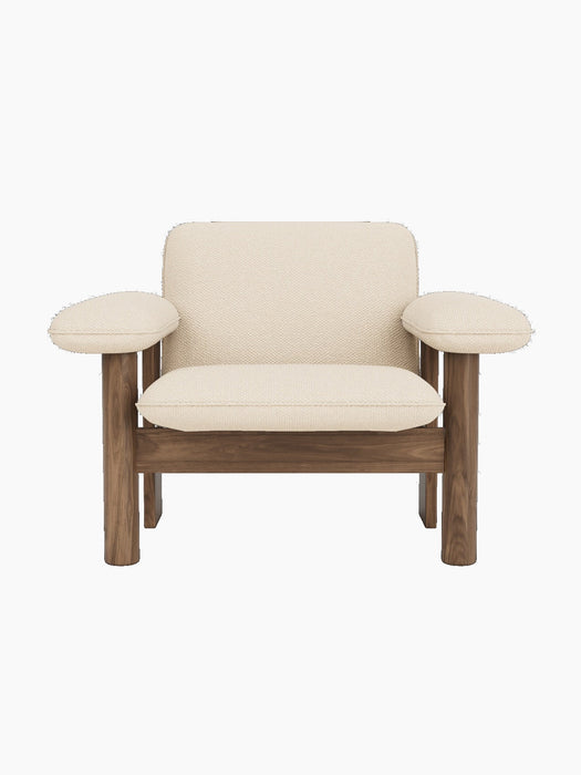 Front view of the Brasilia Lounge Chair with a low back, featuring a solid walnut frame and off-white Logan Jasmine textile.
