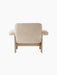 Back view of the Brasilia Lounge Chair with a low back, upholstered in cream sheepskin with a solid natural oak frame.