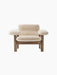 Front view of the Brasilia Lounge Chair, Low Back, Sheepskin, with a dark wood frame and cream sheepskin upholstery.