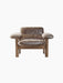 Front view of the Brasilia Lounge Chair in brown sheepskin with a low back and dark wood frame with rounded legs and arms.