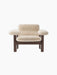 Front view of the Brasilia Lounge Chair, Low Back, with a dark oak frame and plush, off-white sheepskin upholstery.