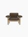 Front view of the Brasilia Lounge Chair, Low Back. The chair has a natural oak frame and dark brown Sheepskin Root upholstery