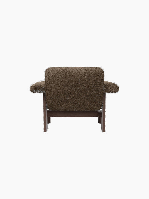 The Brasilia Lounge Chair, Low Back, Sheepskin, viewed from behind with brown textured upholstery and a dark wood frame.
