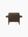 A back view of the Brasilia Lounge Chair with a low back, upholstered in brown sheepskin with a dark wooden frame.
